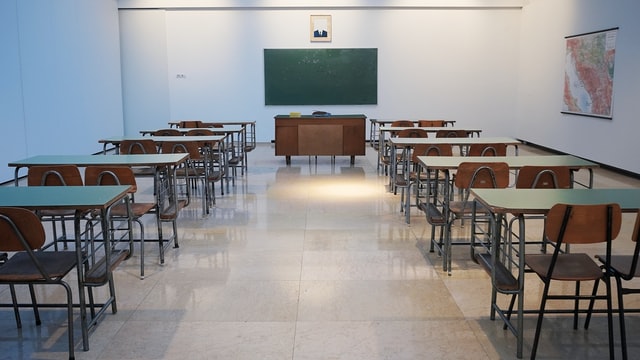 Classroom with blackboard and chairs showing daily routine of a student